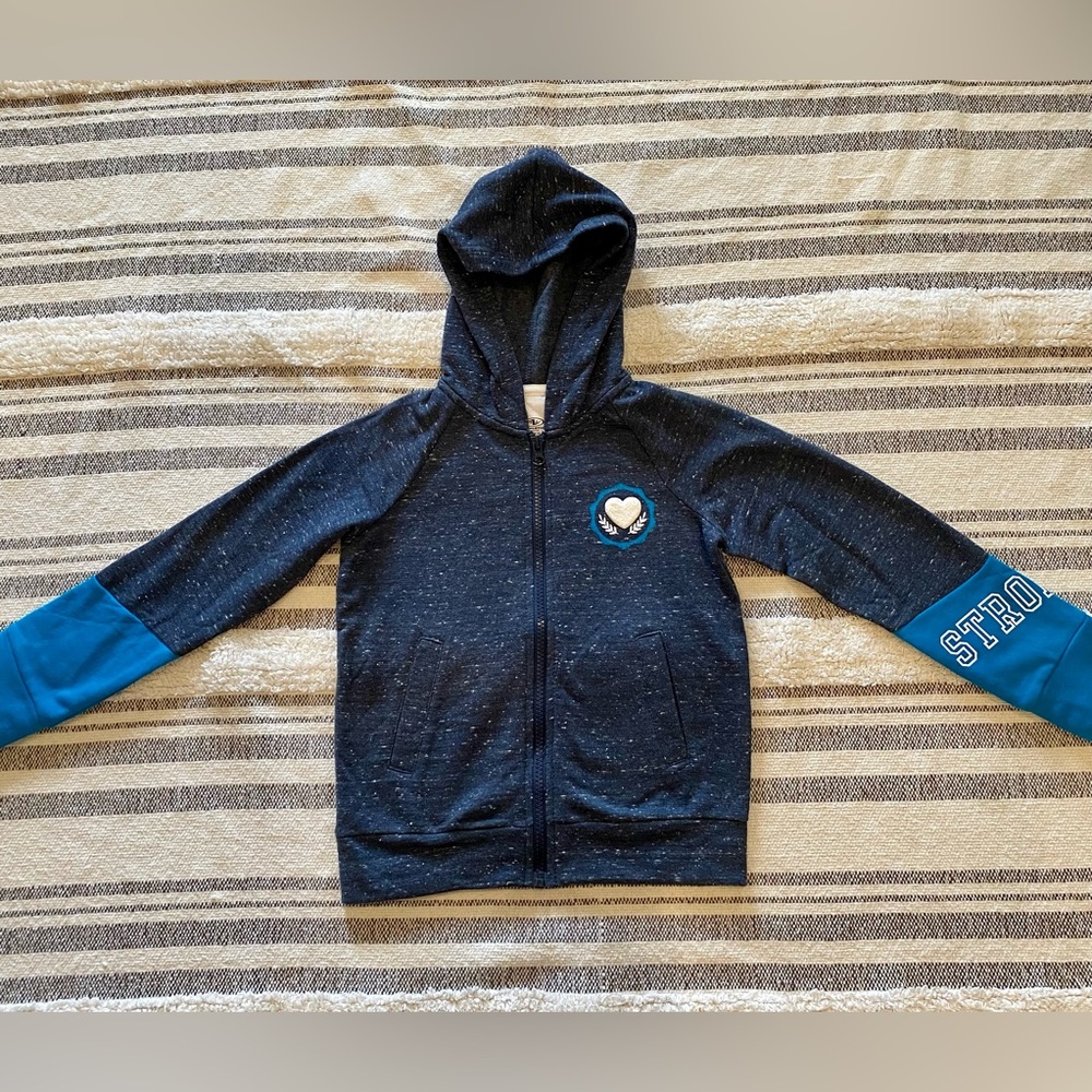Girl’s size 4/5 zip-up hoodie. NWOT! Never been worn!
